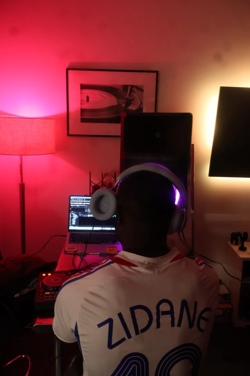 A-WIRE at the decks in a red-lit room