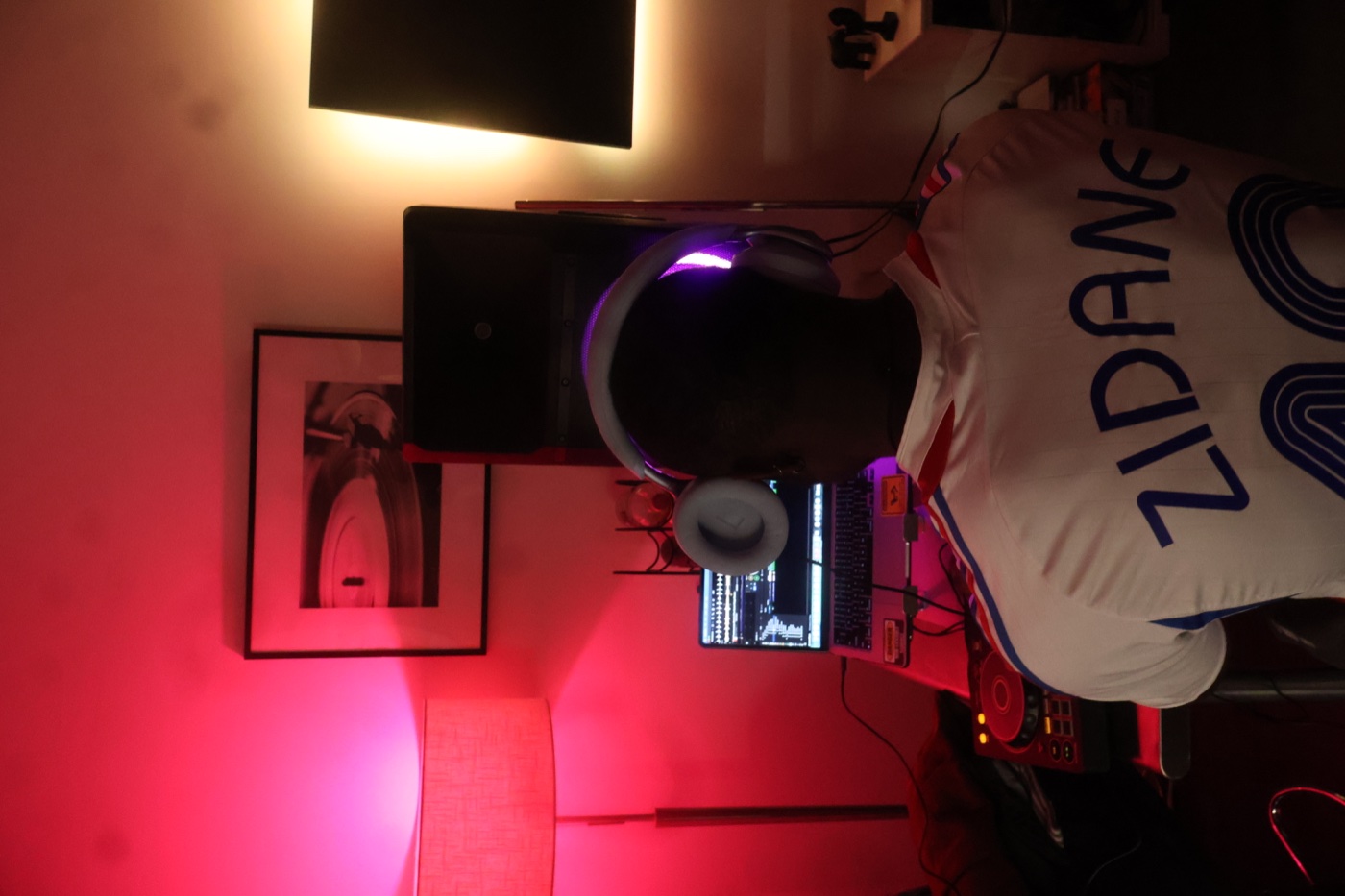 A-WIRE at the decks in a red-lit room